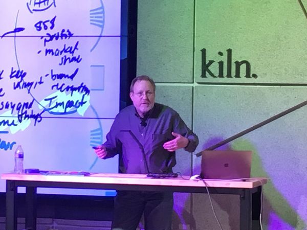 A speaker presenting at a Utah Agile event